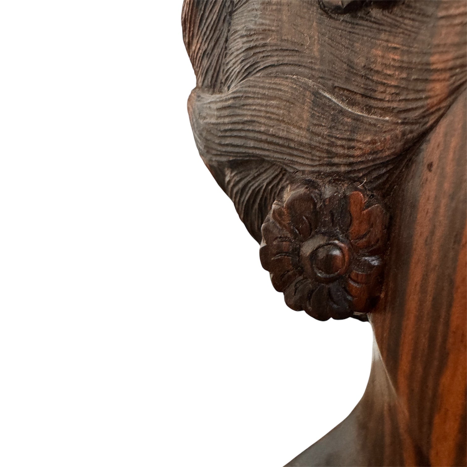An elegant hand-carved bust of a woman made from rich, polished dark ebony wood with striking reddish-brown grain patterns running vertically through her face and chest. The sculpture features a serene expression with closed eyes, a slender nose, and relaxed lips. Her voluminous, textured hair rises upward in a Fan-like shape, intricately carved with fine lines and adorned with small, delicate flower details. The bust includes her bare shoulders and upper chest, resting on a flat base.