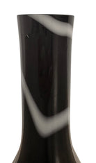 A sleek, hand-blown Polish art glass vase featuring a tall, slender neck that flares into a rounded, bulbous body. The vase is made of opaque black glass decorated with a continuous white spiral ribbon that winds around the entire piece from base to rim. The high-gloss, reflective surface creates sharp highlights, emphasizing its smooth, sculptural silhouette against a plain white background.
