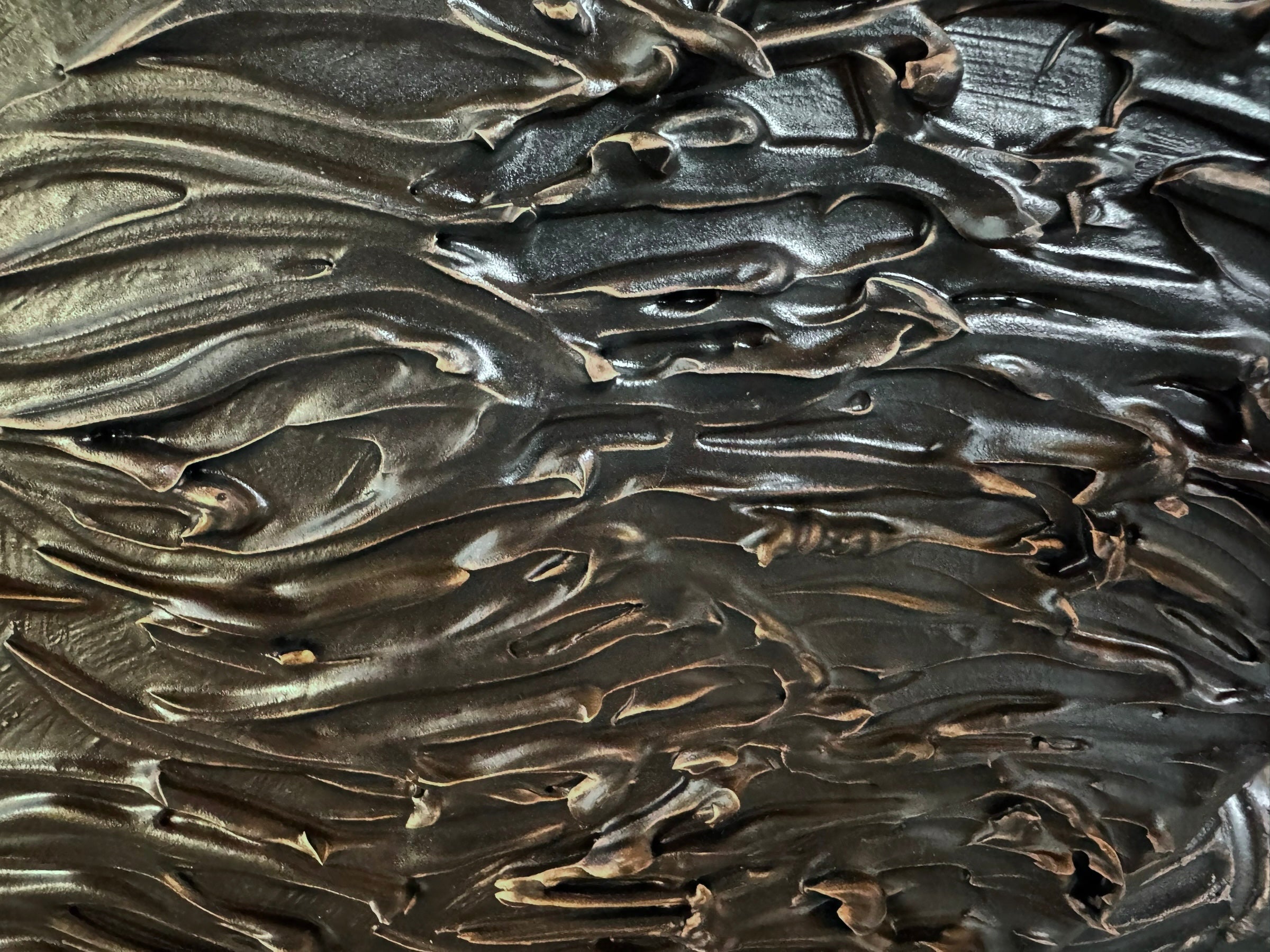 A dark, chocolate-brown ceramic sculpture by Enza Fasano depicting the stylized head of a hunting dog, such as a pointer or hound. The piece features a smooth, elongated snout and large, floppy ears with a textured, feathery finish that contrasts with the sleek crown of the head. The minimalist design emphasizes the dog's elegant profile and long neck.