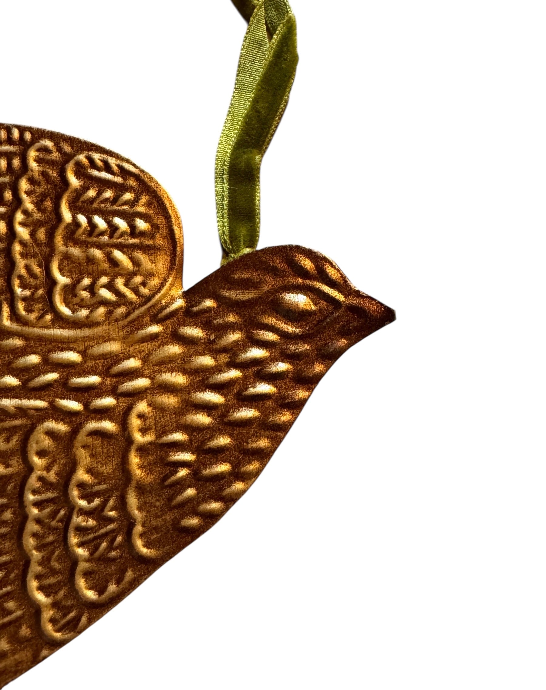 mage of a vintage-style, gilded tin bird with embossed feather detailing. A green velvet ribbon is attached. Front and back views shown.