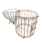 A single, white or cream-colored, decorative wrought iron bird cage with a hinged door and a hanging loop at the top. The cage has a vintage or antique style 