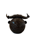 Glossy dark brown ceramic bull sculpture with intricate, hand-incised swirling patterns and a nose ring.