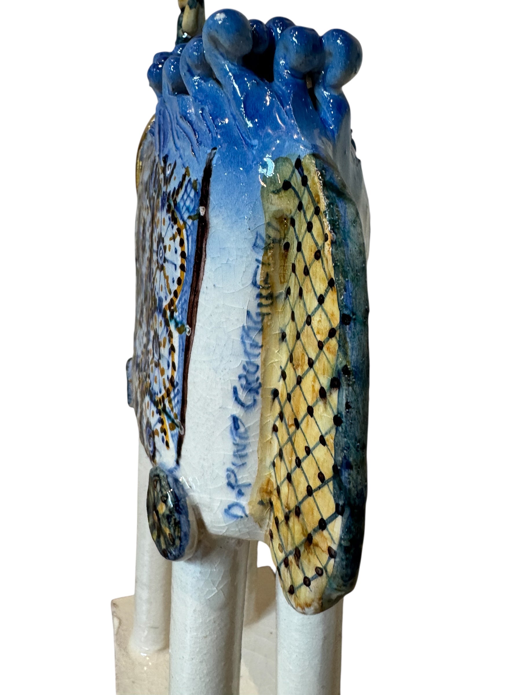 Ceramic horse by Domenico Pinto, featuring a white glazed body, geometric quilting on the saddle, a decorative crown with black and gold accents, and 24Kt gold detailing. The horse stands on four legs and is placed on a white base.