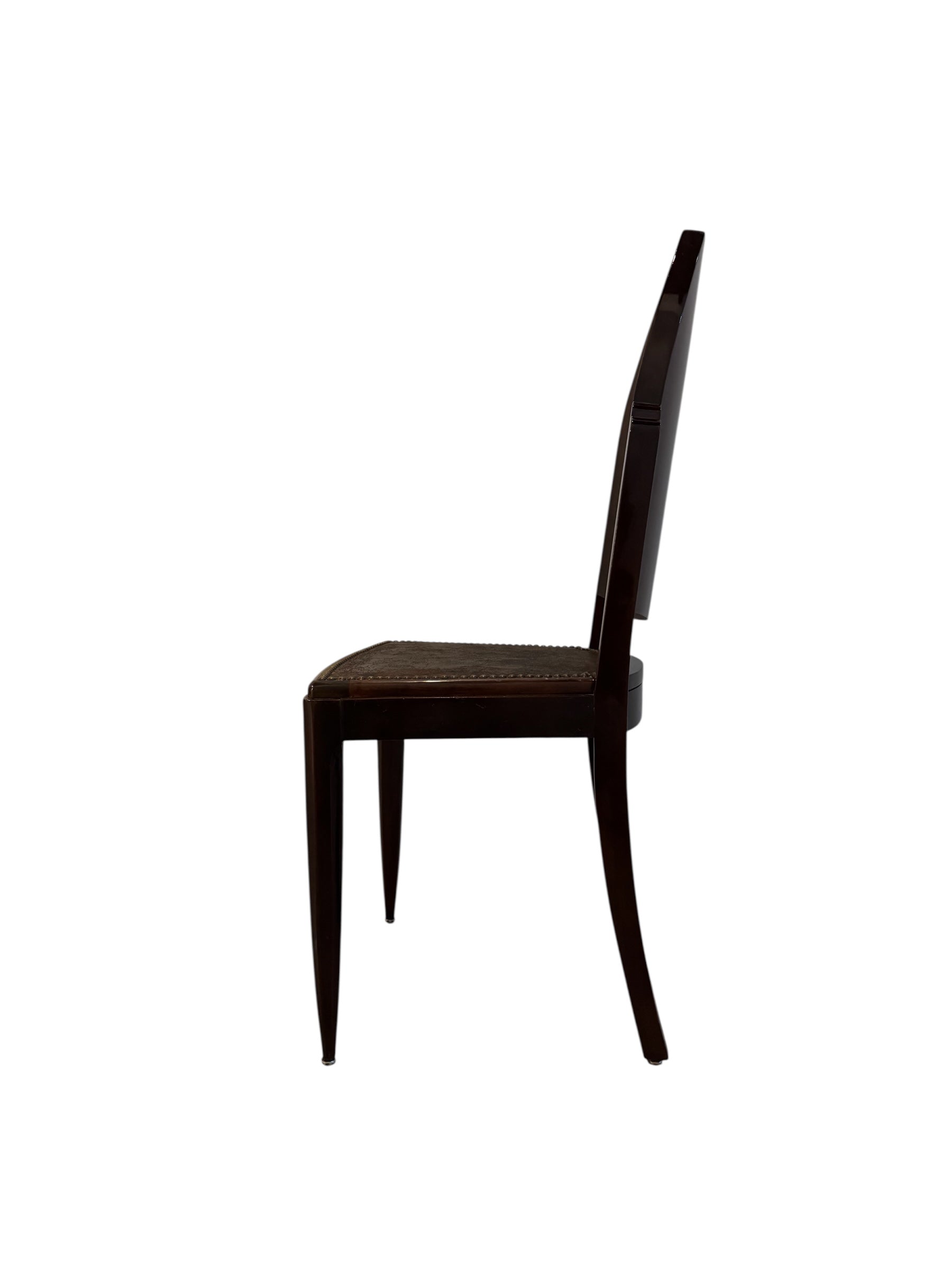  Art Deco chair featuring the leather upholstery, nail head trim, and mahogany frame.