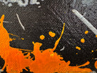 An abstract, vertical-oriented canvas painting featuring a dark background layered with highly textured, horizontal bands. The composition alternates between solid black strips and dense, speckled white-and-grey patterns that resemble static or stone texture. Splattered across the surface are energetic drips, lines, and splotches of bright yellow, stark white, and grey paint, creating a chaotic yet rhythmic sense of movement overlaying the geometric structure underneath.