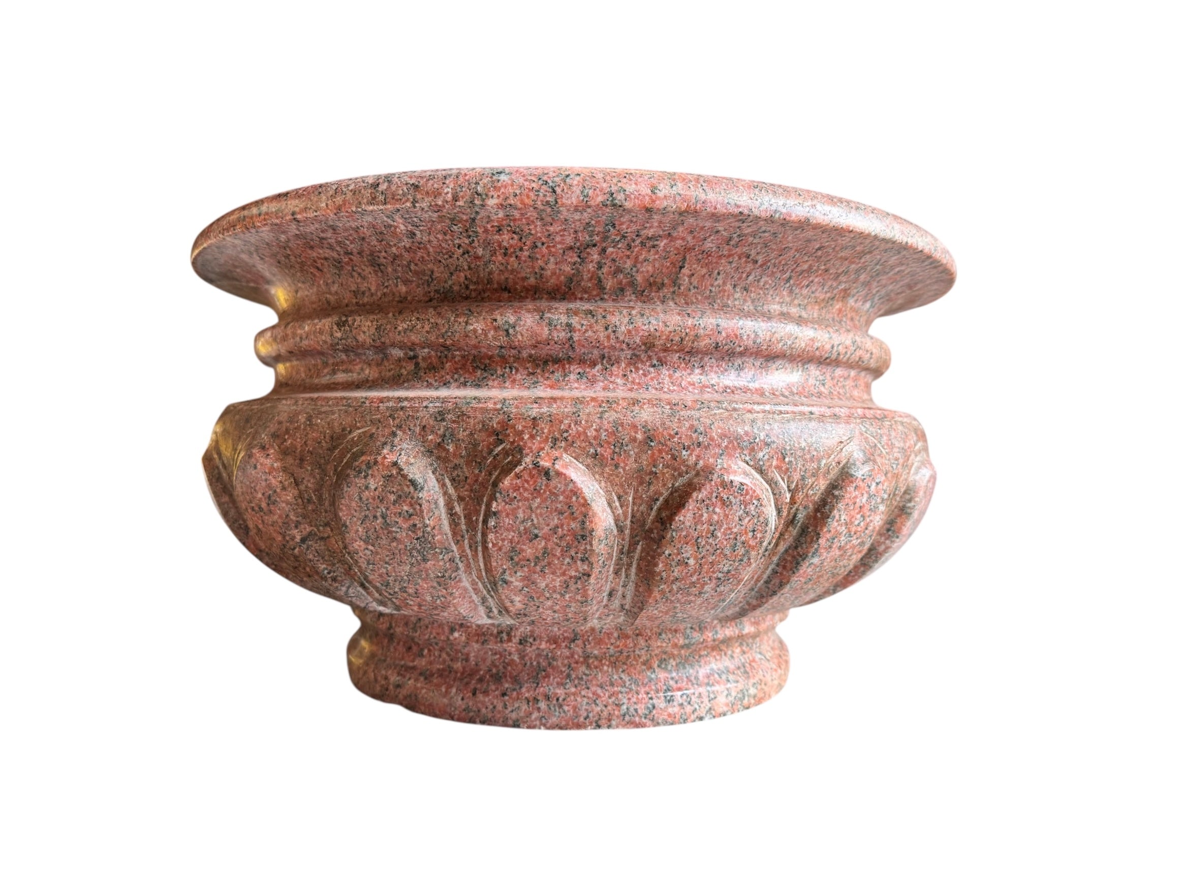 A carved pink granite planter with a leaf pattern, designed for indoor use without drainage.