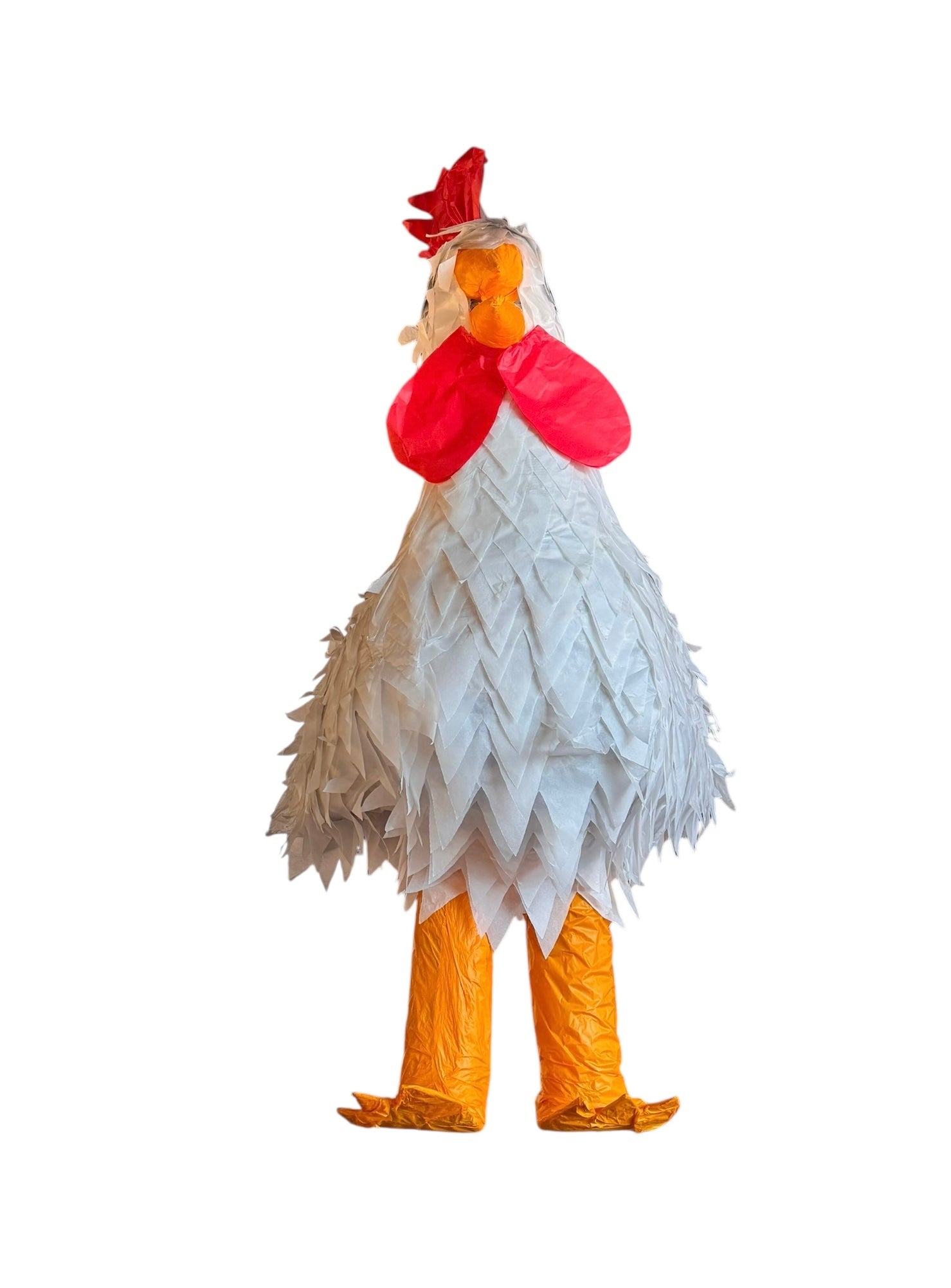 A white chicken pinata with red comb and wattles, and orange beak and legs, standing upright.