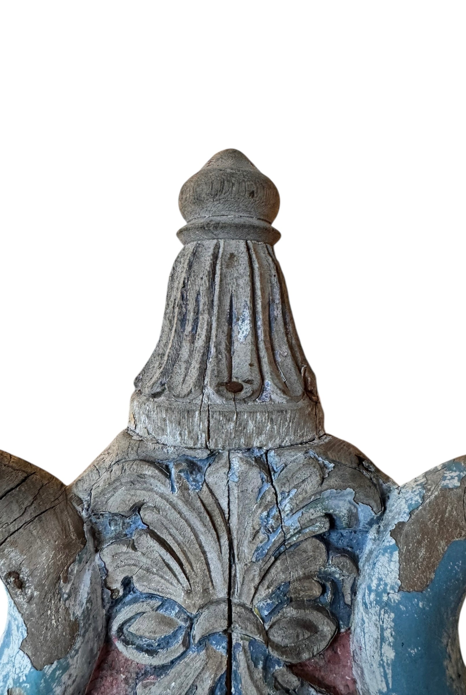 A pair of antique, heavily carved Anglo-Indian style throne chairs featuring lion figures as legs and arm supports, and peacock motifs on the backrests. The chairs have a distressed, multi-colored painted finish.