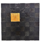 A triptych of abstract paintings featuring a grid pattern of textured black squares by Sabine Stromeyer called “Square One”. The left and right panels each have a single vertical gold rectangle in the center, while the middle panel has two stacked gold rectangles in the center.