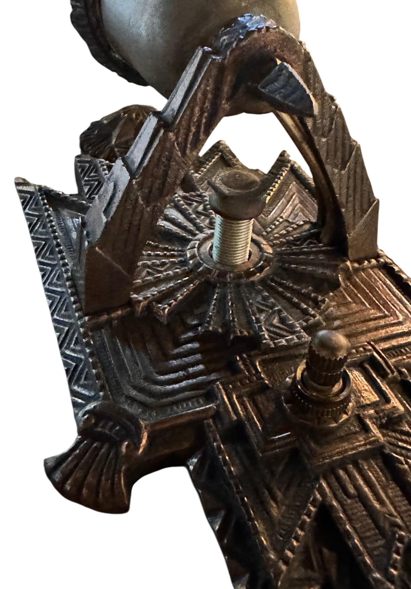 Pair of Art Deco sconces, circa 1930, in cast metal with geometric designs, professionally rewired