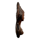 An elegant hand-carved bust of a woman made from rich, polished dark ebony wood with striking reddish-brown grain patterns running vertically through her face and chest. The sculpture features a serene expression with closed eyes, a slender nose, and relaxed lips. Her voluminous, textured hair rises upward in a Fan-like shape, intricately carved with fine lines and adorned with small, delicate flower details. The bust includes her bare shoulders and upper chest, resting on a flat base.