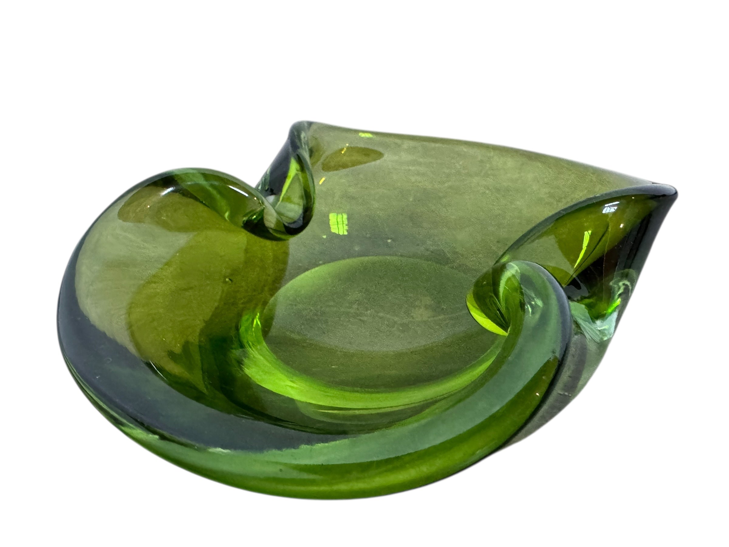 A vintage, Mid-Century Modern, peridot green art glass ashtray or catchall bowl with a curved, free-form design.