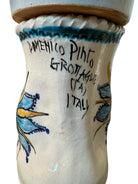 Close-up of Domenico Pinto's 'Mare Dentro' ceramic sculpture: foot, ship with gold sail, Apulian style