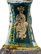 Close-up of Domenico Pinto's 'Mare Dentro' ceramic sculpture: foot, ship with gold sail, Apulian style