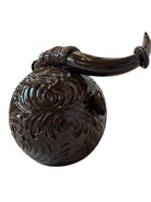 Glossy dark brown ceramic bull sculpture with intricate, hand-incised swirling patterns and a nose ring.