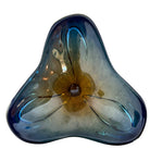 A vintage, hand-blown art glass bowl with a wavy, organic shape and a blue and amber/yellow swirl design