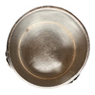 The set includes a large, rectangular, hammered copper tray with geometric openwork handles. Resting on the tray is a tall, slightly tapered copper coffee pot with a wooden handle, a matching smaller creamer pitcher with a similar wooden handle, a lidded sugar bowl, and a tiny matching metal cup or jigger. To the right off the tray sits a large, spherical copper water pitcher or jug with a wide mouth and ice lip.