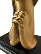 Cast bronze bust of a woman, mid-century Korean design, on a dark wood base. The figure has stylized flowing hair and no mouth.