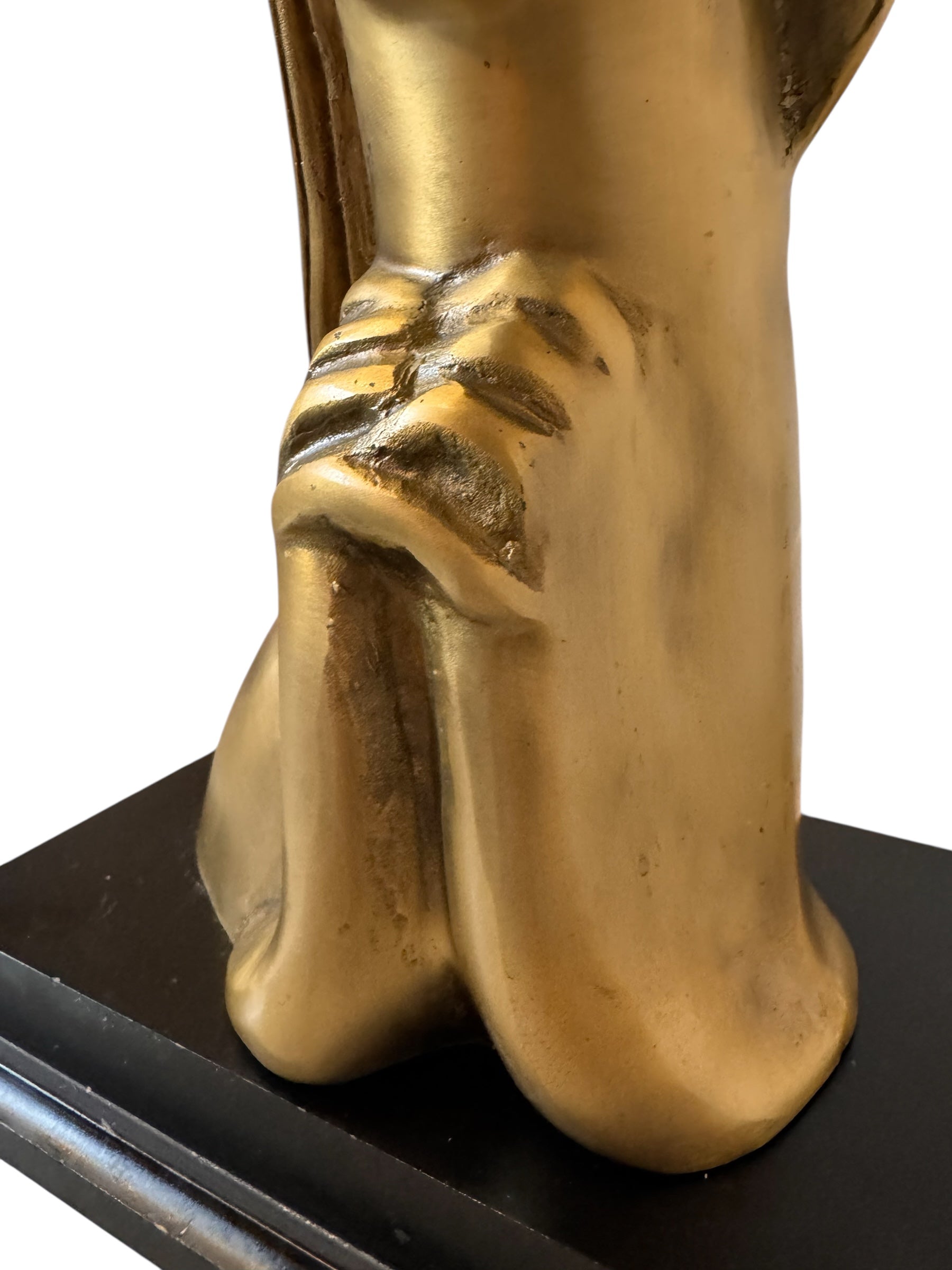 Cast bronze bust of a woman, mid-century Korean design, on a dark wood base. The figure has stylized flowing hair and no mouth.