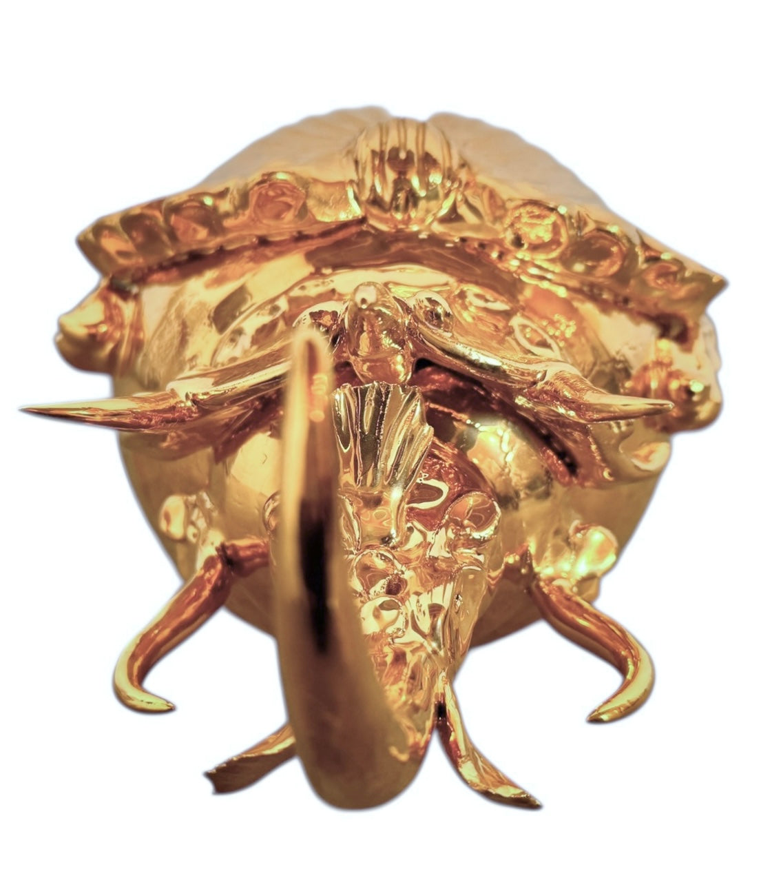 A handcrafted ceramic sculpture of a rhinoceros beetle by Enza Fasano, featuring a brilliant, high-gloss gold metallic finish. The beetle is captured in a dynamic, slightly upturned pose with detailed textures on its ribbed shell and prominent, curved horns. The piece reflects light across its polished surface, showcasing the artist’s signature fusion of traditional Pugliese pottery and contemporary luxury.