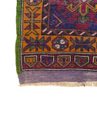 Anatolian Yastik rug with red, gold, green and gray geometric patterns and fringe.
