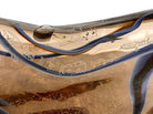 An asymmetrical Murano art glass sculpture with a heavy, biomorphic form. The piece is composed of thick, translucent smoky-amber glass with abstract, fluid bands of deep blue and dark brown swirling throughout the upper rim and sides. A dense pattern of tiny, controlled air bubbles is suspended inside the glass, concentrating heavily near the thick, solid amber base.