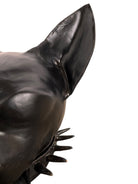 A smooth, dark black-colored ceramic sculpture of a Miniature Pinscher's head. The stylized dog features large, upright pointed ears and a prominent spiked collar around its neck. The surface has a soft sheen, with minimalist indentations for eyes and a rounded snout, creating a sleek and modern aesthetic.