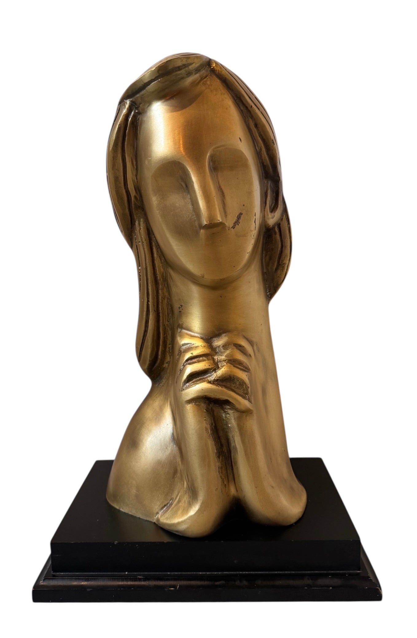 Cast bronze bust of a woman, mid-century Korean design, on a dark wood base. The figure has stylized flowing hair and no mouth.