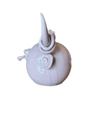 Artistic white grey ceramic bull sculpture by Enza Fasano, featuring a minimalist design and rings on the horns