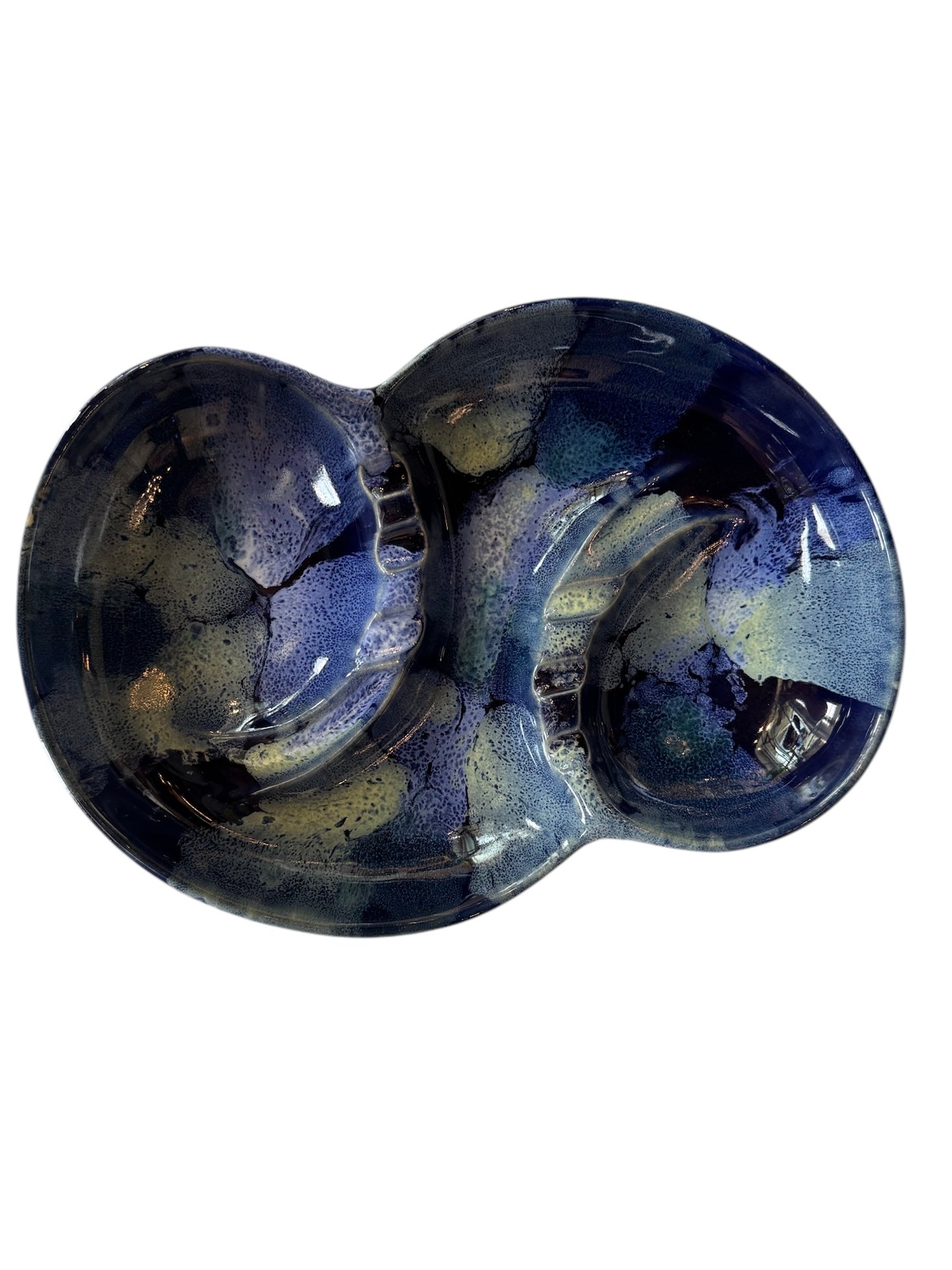 Vintage McCoy ashtray. Glazed in dark blue and marbled with lighter blues. The bottom is stamped 'McCoy USA.'"