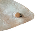 A white and orange, glazed ceramic platter in the shape of a prickly pear cactus pad with attached prickly pear fruit. The surface has raised dots representing spines. 