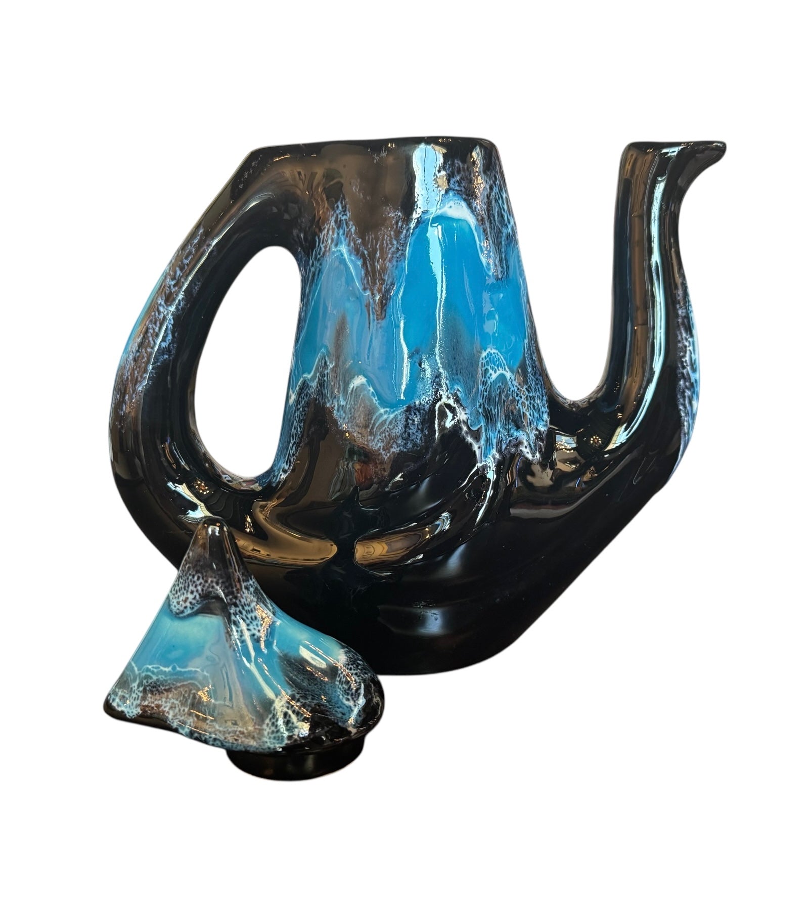 Complete mid-century ceramic tea set with teapot, sugar bowl, cups, and saucers, featuring a bold blue and black "lava drip" glaze reminiscent of Vallauris pottery.