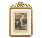 Gold-framed artwork with a nude figure in water 