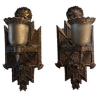 Pair of Art Deco sconces, circa 1930, in cast metal with geometric designs, professionally rewired