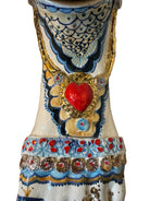 Ceramic foot sculpture by Domenico Pinto featuring hand-painted details, gold accents, a sacred heart, and an angel figure with a blindfold