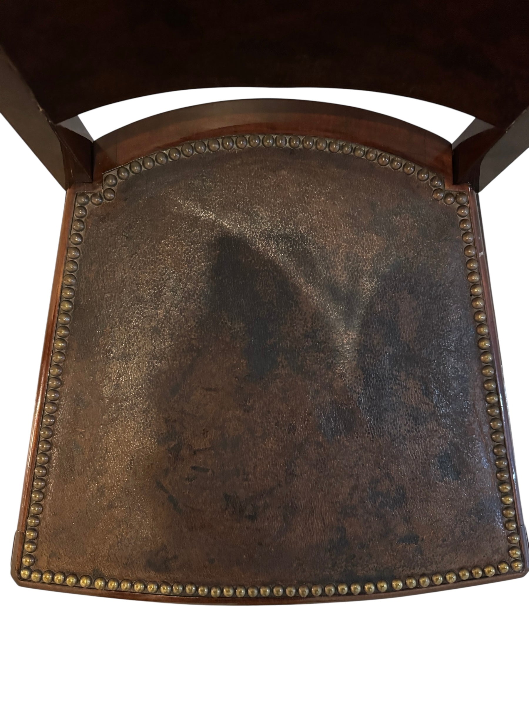  Art Deco chair featuring the leather upholstery, nail head trim, and mahogany frame.