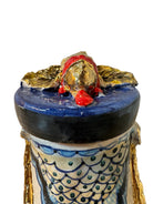Ceramic foot sculpture by Domenico Pinto featuring hand-painted details, gold accents, a sacred heart, and an angel figure with a blindfold