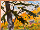 A vibrantly colored landscape painting titled 'Perdernales Falls Fisherman,' featuring two large trees with prominent exposed roots framing a body of water. A lone figure, a fisherman, stands by the water in the middle ground. The painting uses bold strokes of yellow, green, red, and blue, and is enclosed in a rustic dark wooden frame with a light-colored inner mat.