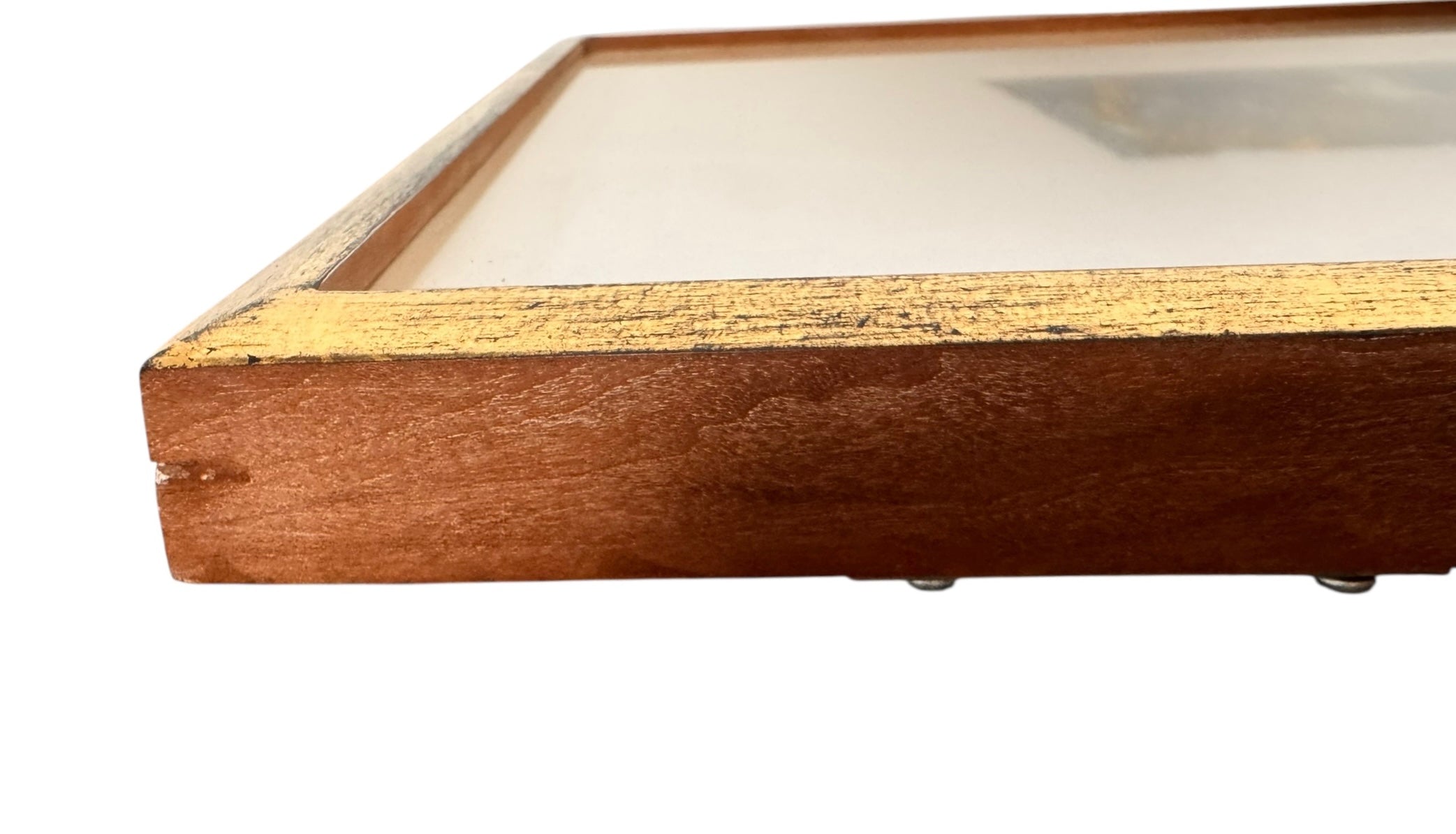 A vertical rectangular artwork, "Embers," by Jill London (2003), framed in a wide, textured gold frame. The piece features a small, abstract expressionist print at the center, rendered in dark, painterly strokes of deep blues, browns, yellows, and white, resembling moving water or smoke. Below the print, on the cream mat, the artist's signature, title, and date are hand-written in pencil. The paper has a delicate, textured deckled edge.