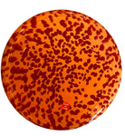 A hand-blown Italian Murano glass vase featuring a wide, bulbous body and a short, flared rim. The glass is a vibrant, translucent amber-orange base decorated with an organic "macchia" or spotted pattern of deep ruby red blotches. The red spots are elongated and vertical near the neck, becoming larger and more rounded toward the base. The surface has a high-gloss, reflective finish, showcasing mid-century modern craftsmanship.
