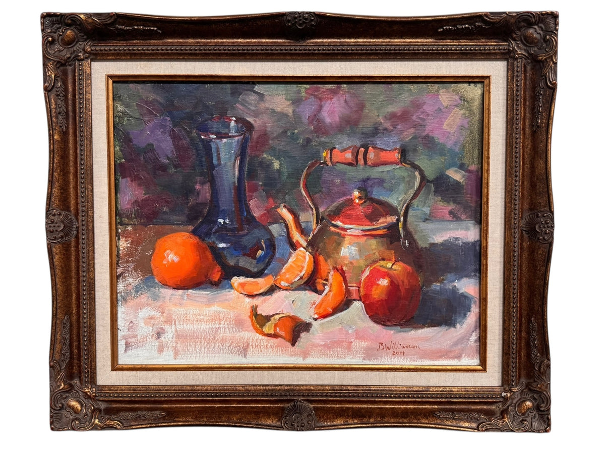An oil painting still life featuring a copper teapot with a wooden handle, a blue glass vase, a red apple, a whole orange, and several orange slices, all arranged on a white tablecloth against a blurred purple and green background. The artist's signature "B. Willamson 2019" is visible in the bottom right corner.