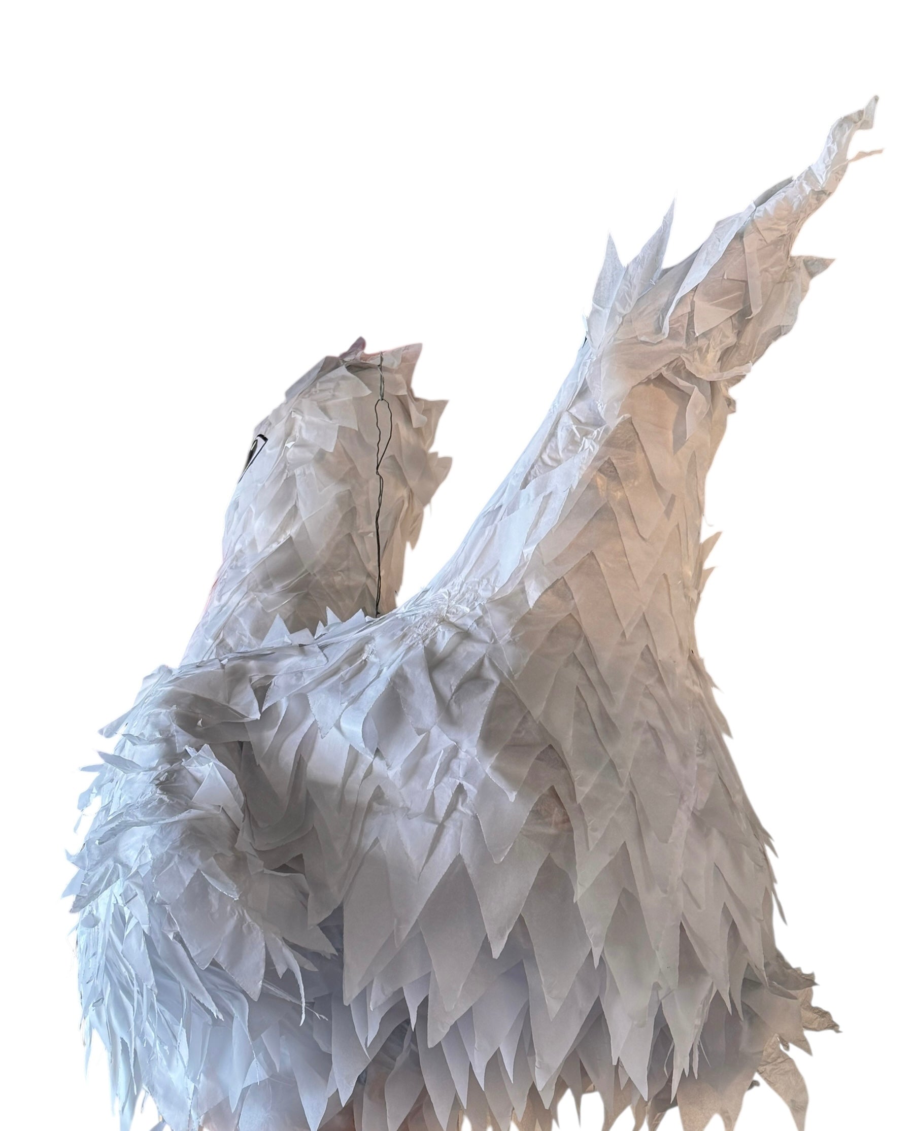 A white chicken pinata with red comb and wattles, and orange beak and legs, standing upright.