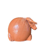 Terracotta colored ceramic Highland cow sculpture with a shaggy coat and curved horns