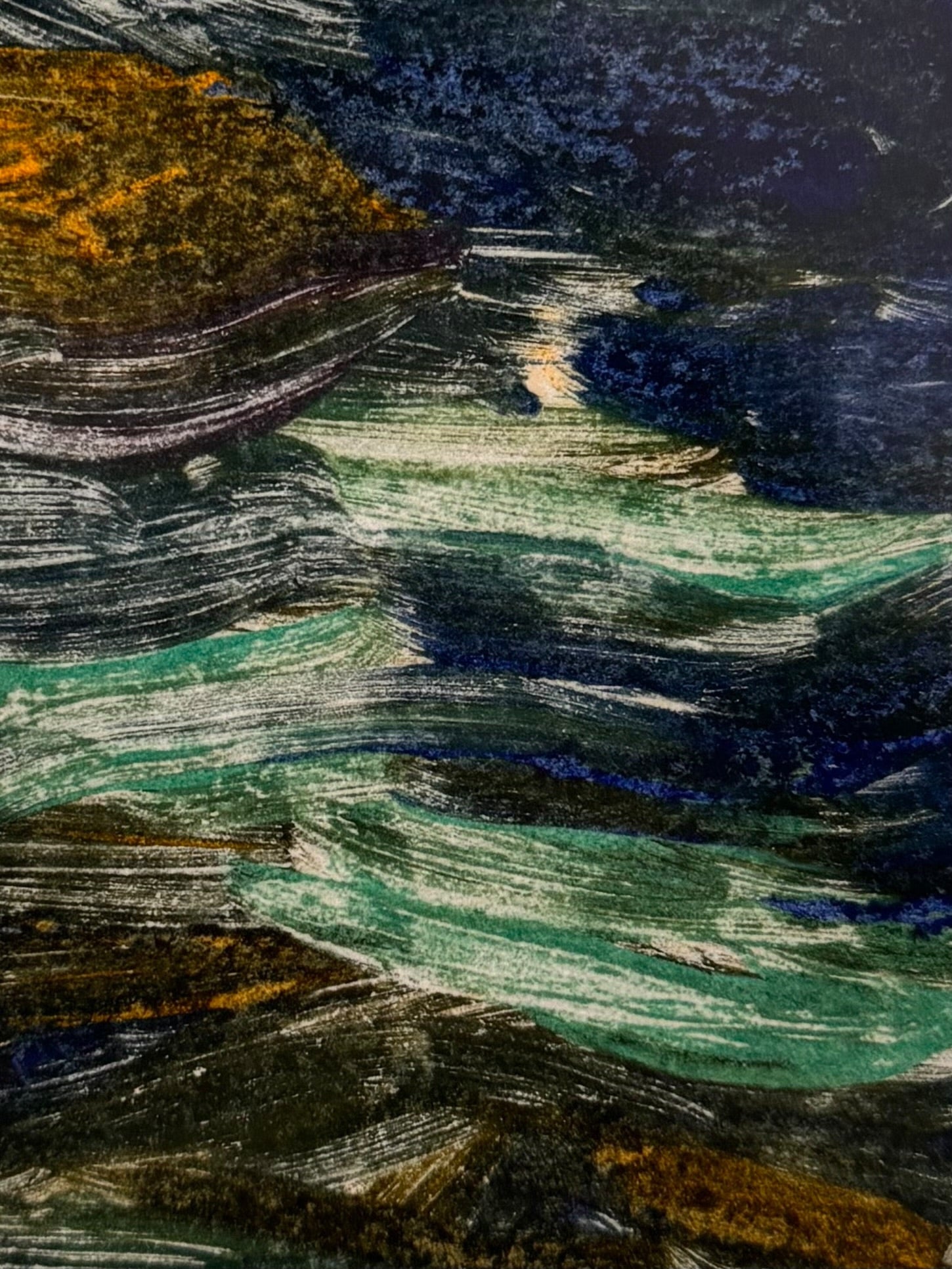 A vertical rectangular artwork, "Embers," by Jill London (2003), framed in a wide, textured gold frame. The piece features a small, abstract expressionist print at the center, rendered in dark, painterly strokes of deep blues, browns, yellows, and white, resembling moving water or smoke. Below the print, on the cream mat, the artist's signature, title, and date are hand-written in pencil. The paper has a delicate, textured deckled edge.