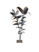 Mid-century Brutalist sculpture made of brass and bronze, depicting a stylized plant with textured, oxidized surfaces.