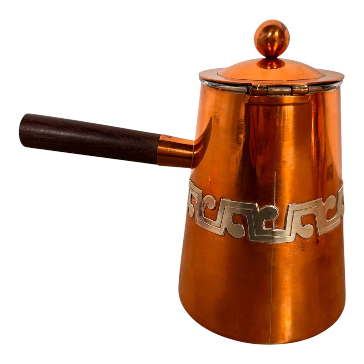 The set includes a large, rectangular, hammered copper tray with geometric openwork handles. Resting on the tray is a tall, slightly tapered copper coffee pot with a wooden handle, a matching smaller creamer pitcher with a similar wooden handle, a lidded sugar bowl, and a tiny matching metal cup or jigger. To the right off the tray sits a large, spherical copper water pitcher or jug with a wide mouth and ice lip.
