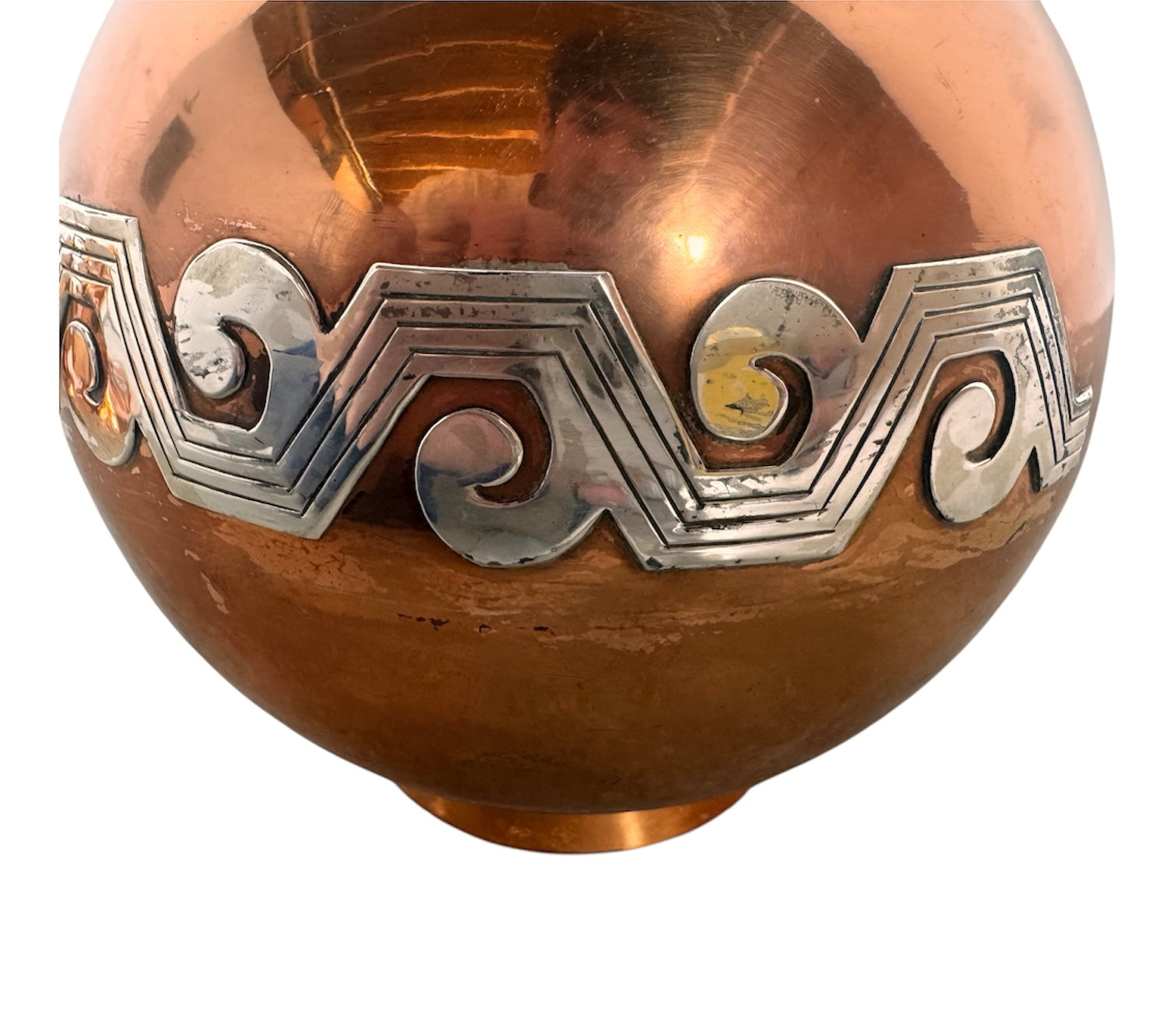 The set includes a large, rectangular, hammered copper tray with geometric openwork handles. Resting on the tray is a tall, slightly tapered copper coffee pot with a wooden handle, a matching smaller creamer pitcher with a similar wooden handle, a lidded sugar bowl, and a tiny matching metal cup or jigger. To the right off the tray sits a large, spherical copper water pitcher or jug with a wide mouth and ice lip.