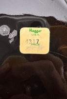 A round, glossy black vase with a small opening.
The vase has a spherical or gourd-like shape and a highly reflective, black glazed finish.