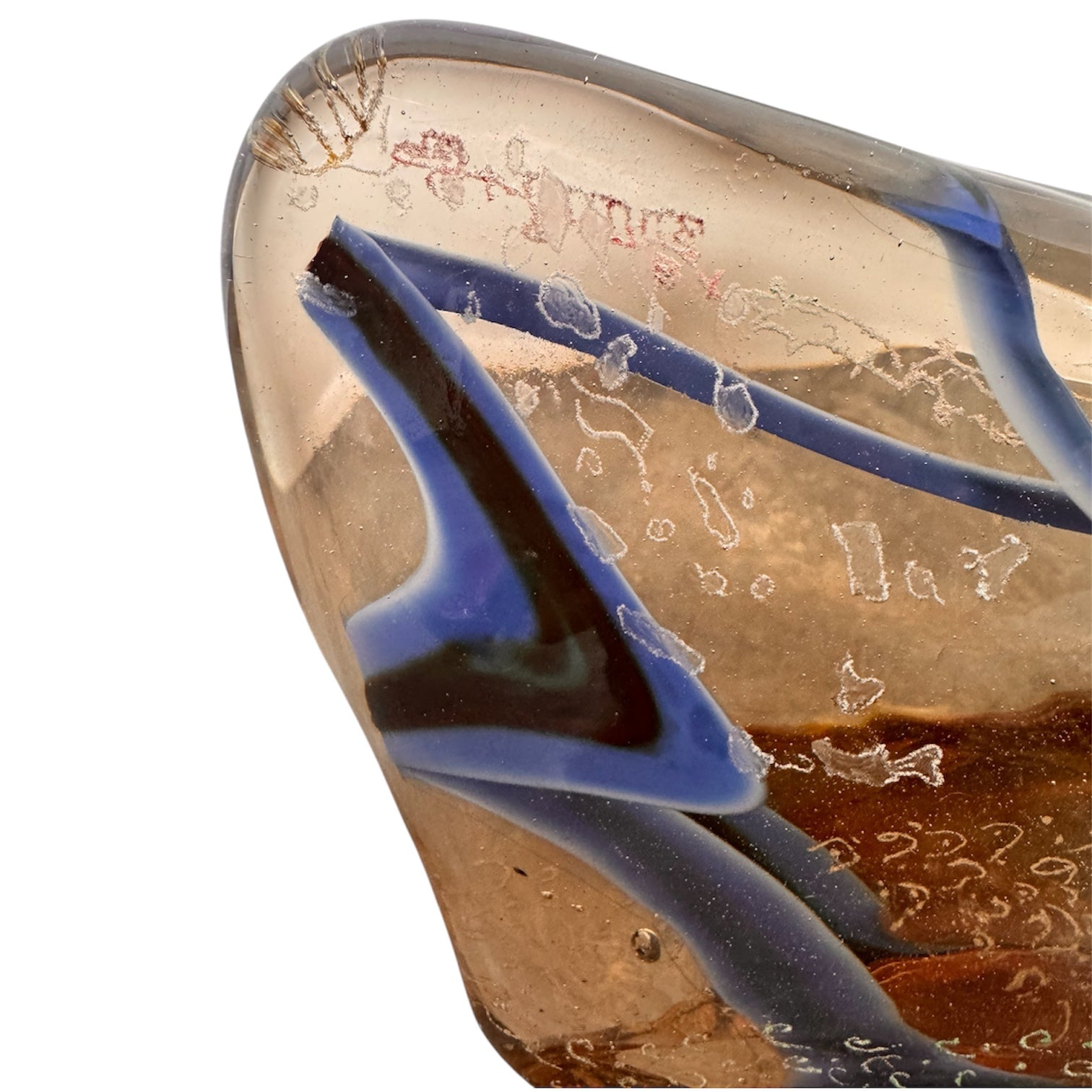 An asymmetrical Murano art glass sculpture with a heavy, biomorphic form. The piece is composed of thick, translucent smoky-amber glass with abstract, fluid bands of deep blue and dark brown swirling throughout the upper rim and sides. A dense pattern of tiny, controlled air bubbles is suspended inside the glass, concentrating heavily near the thick, solid amber base.