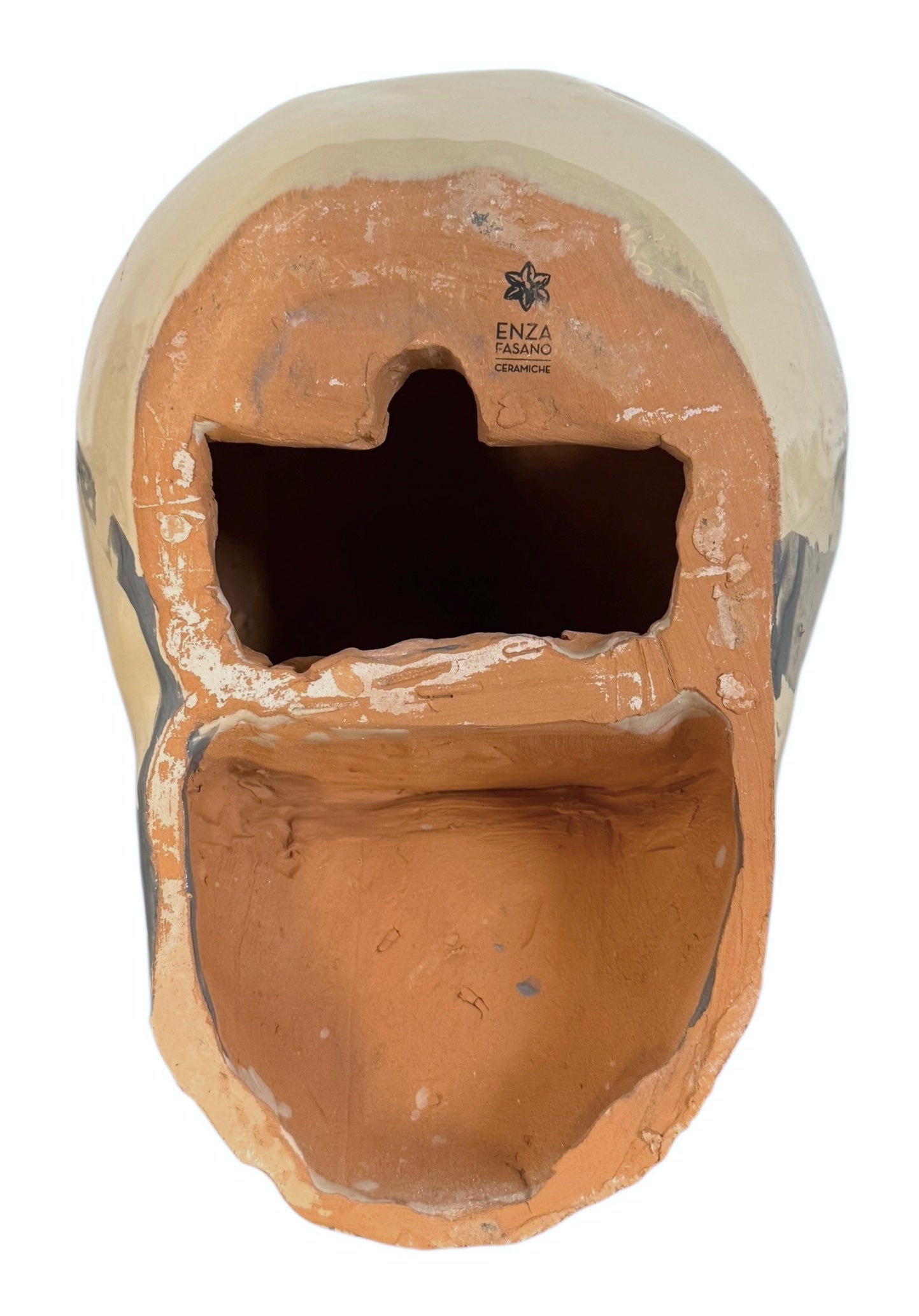 A ceramic sculpture of a bulldog's head by Enza Fasano. The piece features a glossy, glazed finish with a sophisticated color palette of muted greys, creams, and earthy brown tones arranged in bold, abstract striped patterns across the face and ears. The bulldog has characteristic folded ears, a prominent snout, and a soulful, slightly downturned expression. The sculpture is set against a clean, white background, highlighting its smooth texture and reflective surface.